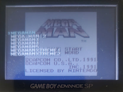 Game Boy Advance SP displaying 'Mega Man' title screen with Capcom and Nintendo logos.