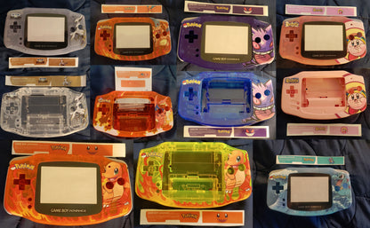 Collection of various Game Boy Advance SP consoles on a dark surface